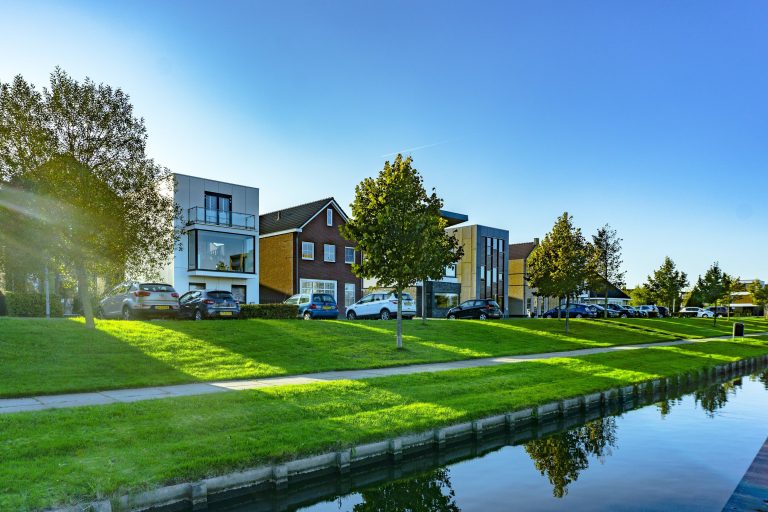 A view of mixed office & residual buildings beside a canal